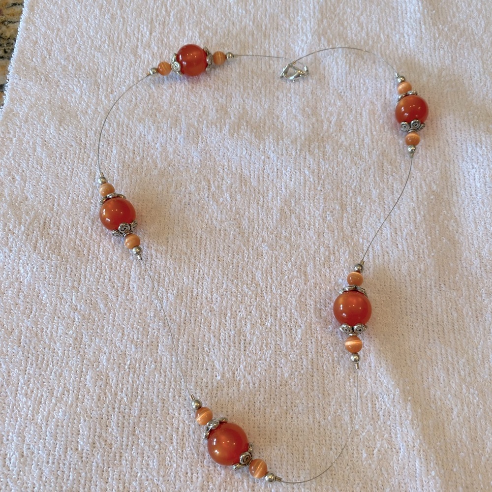 Orange bead illusion necklace